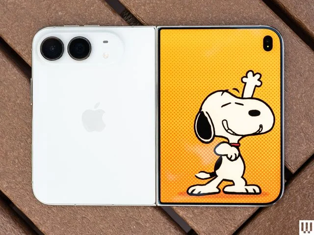 Image may contain Electronics Phone Mobile Phone Animal Bird Penguin Face Head and Person