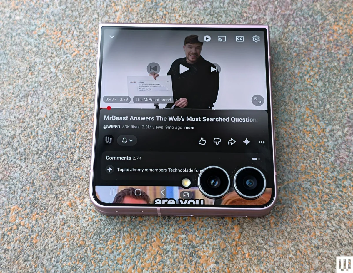 Image may contain MrBeast Electronics Phone Mobile Phone Adult and Person