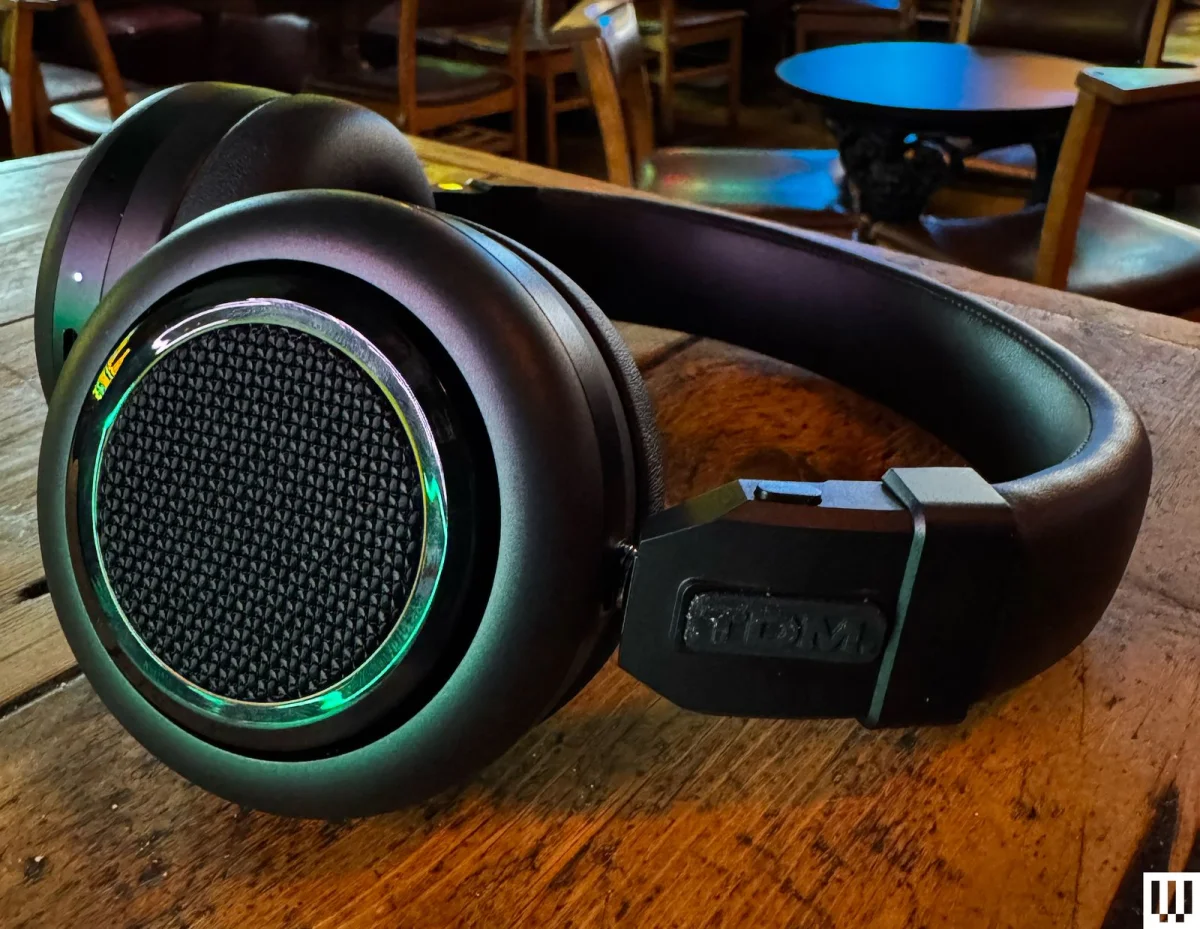 Image may contain Electronics Headphones Chair and Furniture