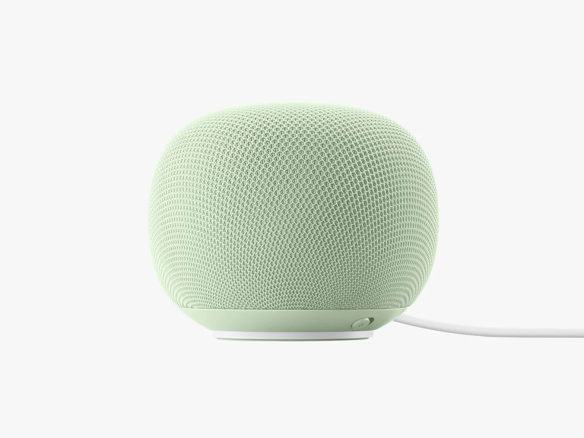 Green spherical speaker with cord coming out of the side