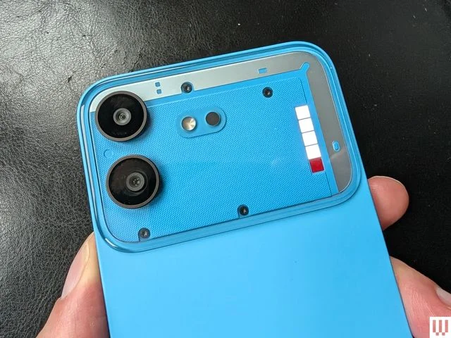 Closeup of the cameras on the back of a slim mobile phone