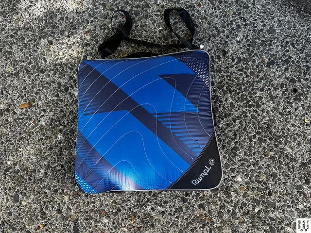Puffy blanket folded up to a square pouch