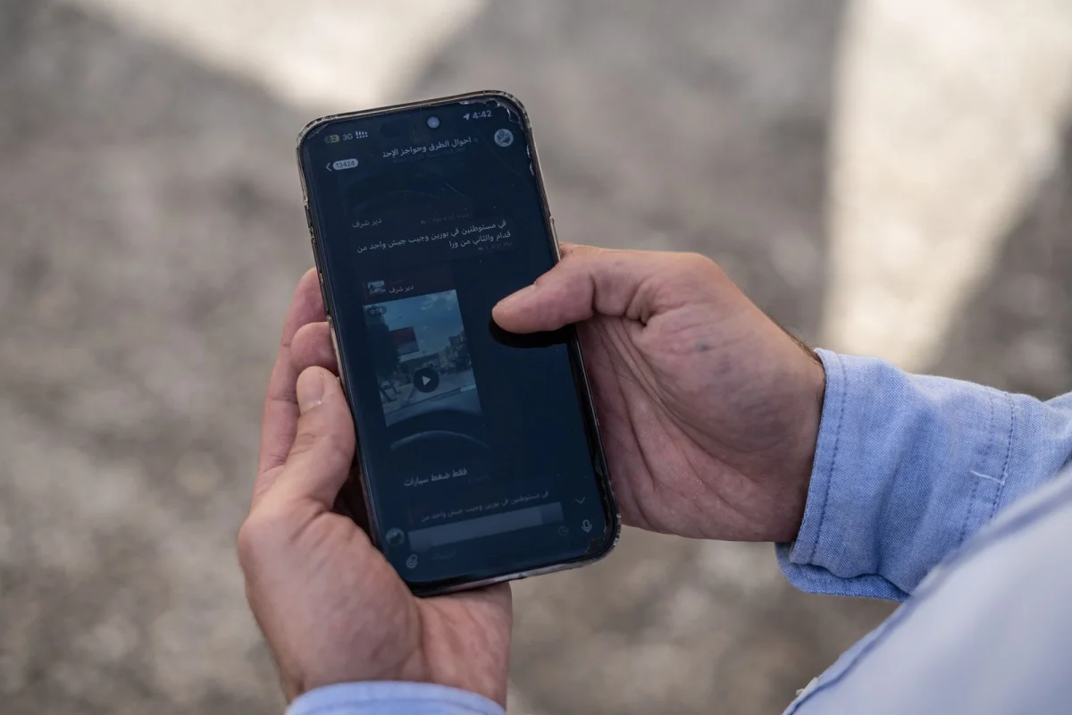 Two hands holding a cellphone.